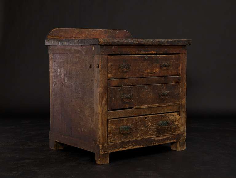 What a great piece, circa 19th century and it shows its age. This seems to have been a work chest at some point in its life, its built like a tank. From what we can tell it looks to be the original pulls and possesses a nice presence in person. The