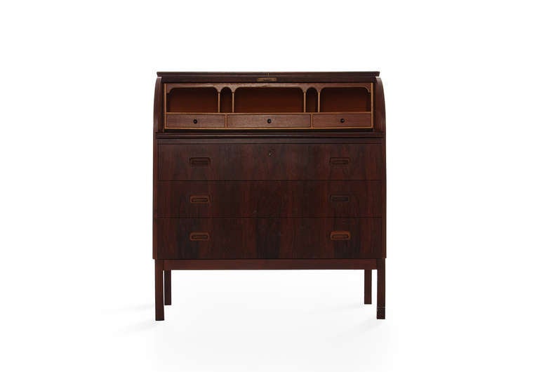 Great attention to detail and beautiful Brazilian rosewood.  What we like about this piece is very nice contrast of the light wood against the rosewood.  Take note of the slightly flared legs the quietly brings extra attention to the desk. The build