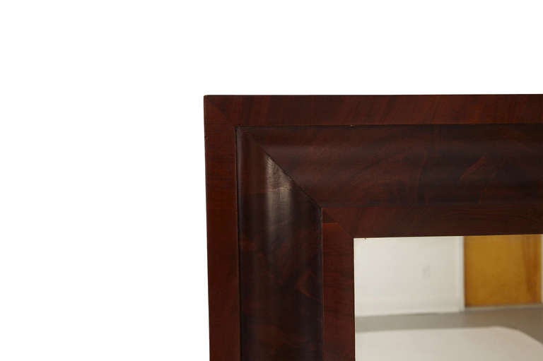 Beautiful handmade early 20th century framed mahogany mirror with nice grain and patina. We especially love the beveled frame against the original glass. Can be hung horizontally as well as vertical.