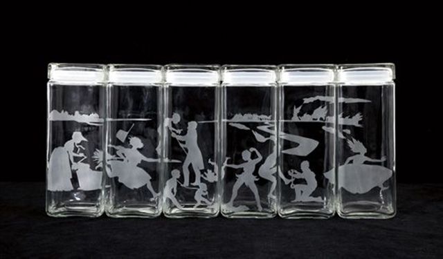 This limited edtion set of six canisters by the acclaimed artist Kara Walker was originally published by the The Renaissance Society at The University of Chicago in 1997.  The edition has long since sold out.  The set we have available has been with