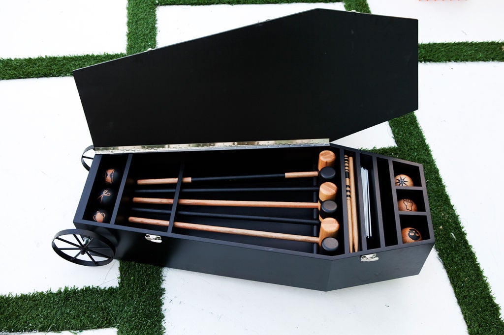 This playful yet macabre Croquet Set by Mark Dion features a full set for play as well as a book of rules all stored in a custom, coffin-shaped cart with wheels. Each of the mallets and balls is a beautiful, handmade object that shows exceptional