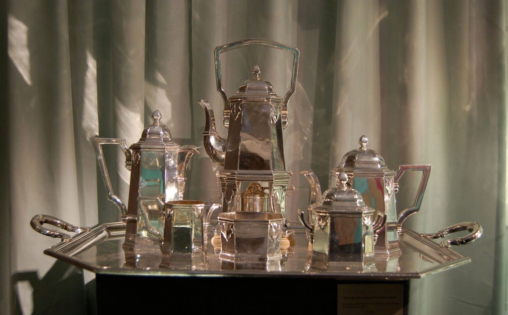 This an extraordinary tea and coffee set by Cartier Paris in sterling silver.  The dimensions of the tray are 20