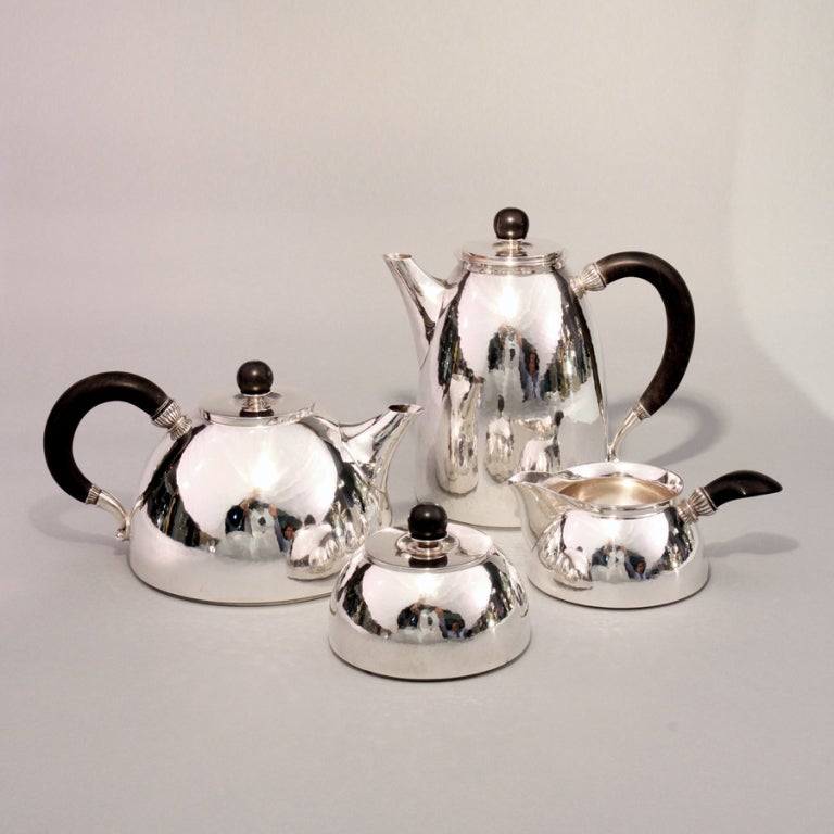 This rare four piece Tea and Coffee set has the design mark of Gundorph Albertus for Georg Jensen occasionally we come across designs and struggle to find any information. This set clearly has the Cactus motif that Albertus designed in 1930 and is