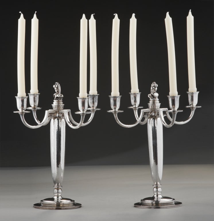 Having built the world's largest and most comprehensive collection of Georg Jensen silver ever, it is rare and exciting for The Silver Fund to find a design that we have never seen before. This monumental pair of four branch candelabra, with makers