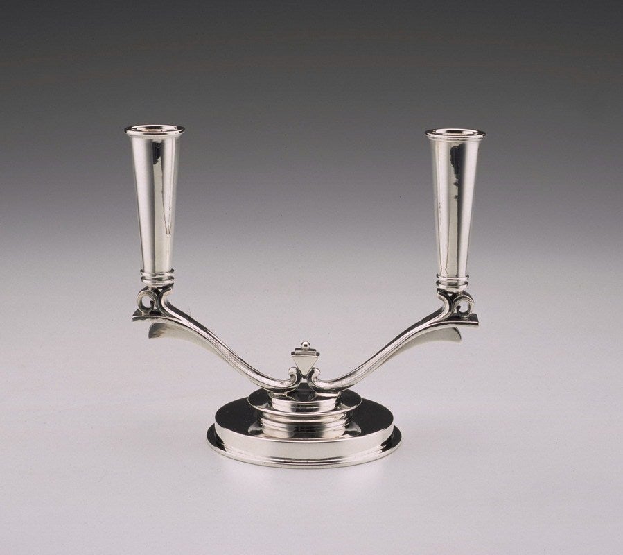 This candelabra is a wonderful example of the Pyramid pattern designed by Harald Nielsen and introduced into the Jensen silversmithy in 1926. Nielsen's designs are characterised by an emphasis on form and line with a minimum of ornamentation. There