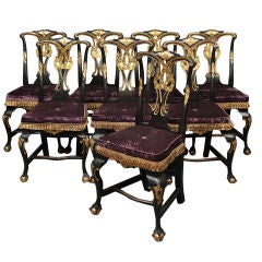 A Set of Eight Ebonised and Parcel Gilt Dining Chairs