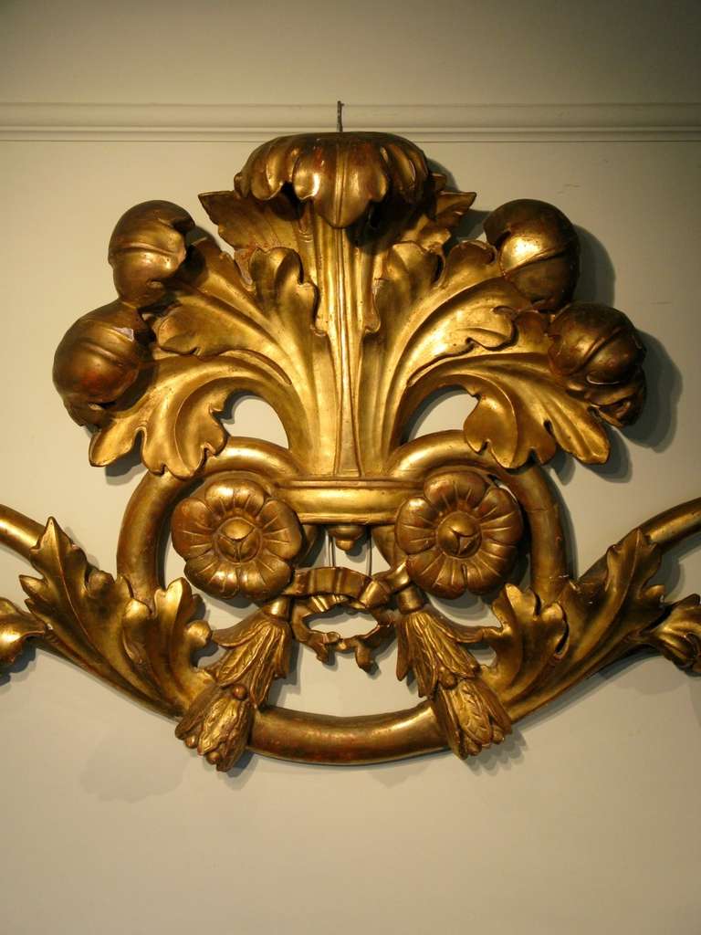 A fine quality, and of large proportions, 19th century Italian carved wood gilded pediment, retaining the original water gilt, and with a lovely carving, that will make a statement in any setting. 
