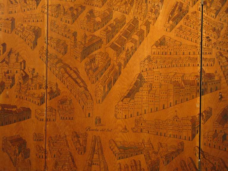 An  outstanding, circa1950s Spanish six fold painted screen in oak and brass, with ink , representing with great detail, a map of Madrid in the 16th century. Dated Madrid 1560 , and highlighted in colours.
On this spectacular screen you can see the