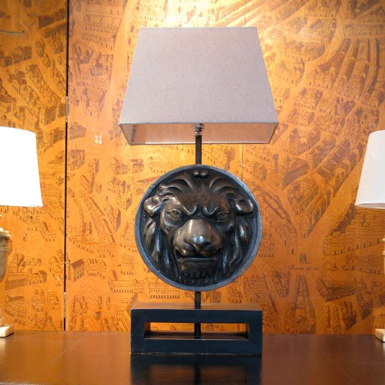 A good quality and with fine detail, circa 1960s, polished steel lion face, been recently adapted as a table lamp by us, and with a linen shade, that will work well in either a classic or contemporary setting. 

