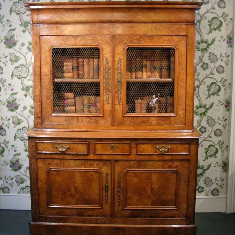 A good quality, and of elegant proportions, 19th century French buffet a deux corpes in Elm , with a lovely colour, and simple lines, that will work well in either a classic or contemporary setting. 
This French Buffet deux Corpes/Cupboard will