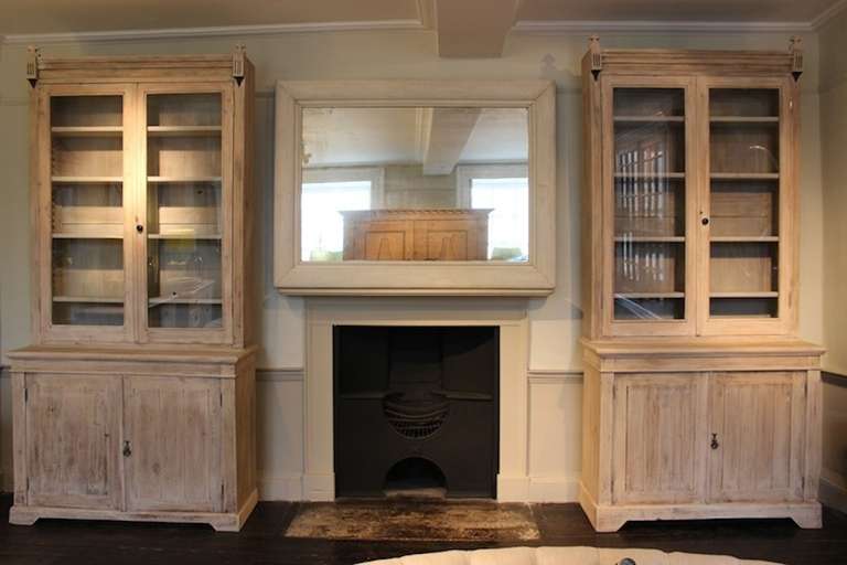 A very smart pair of 19th century French pine bookcases in the gothic taste, of great proportions, with a later paint wash, and adjustable shelves, that will work well in most settings. Either a kitchen or a library. 

One of the bookcases is a