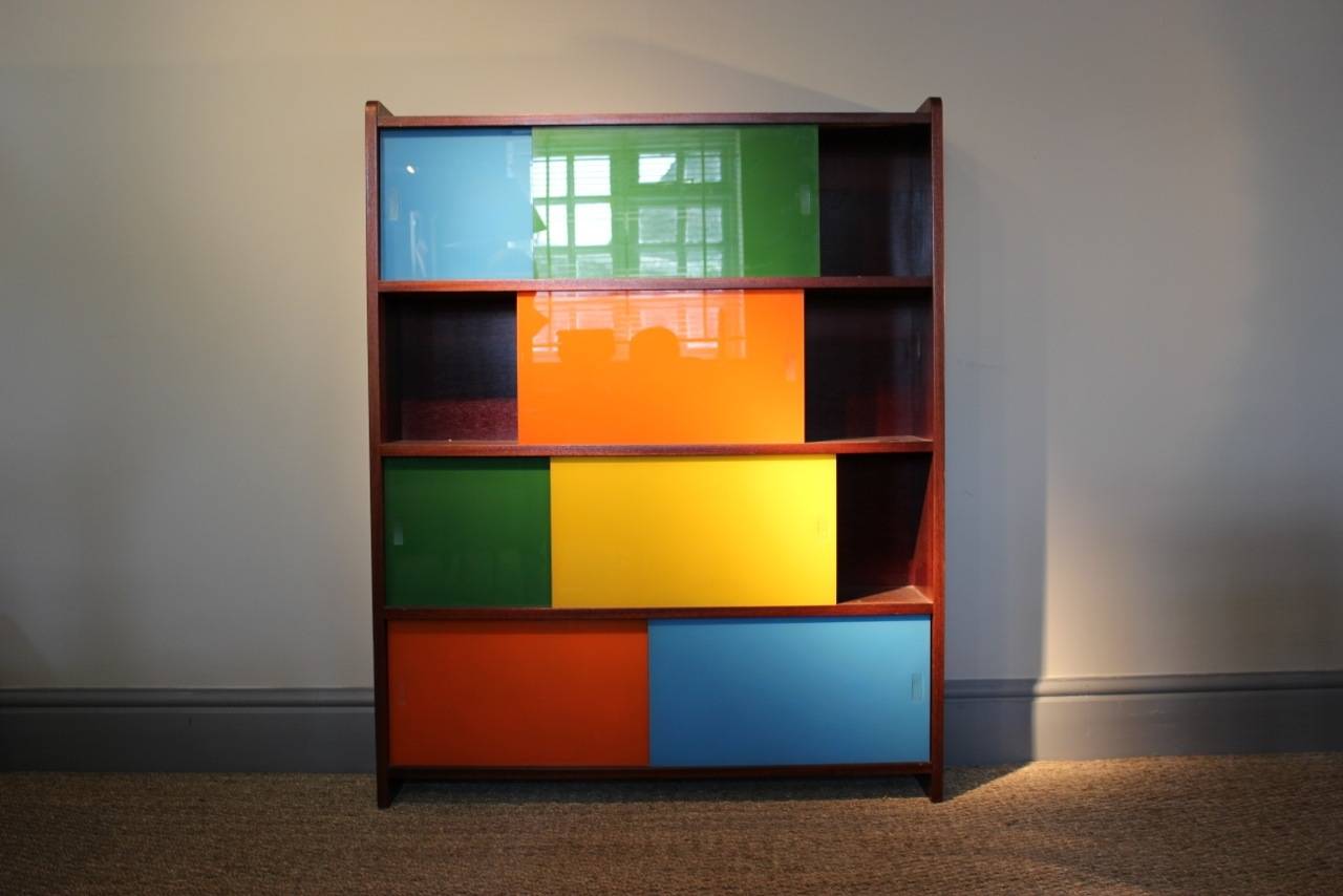A very funky and practical circa 1960s cabinet, with sliding coloured glass doors , and small proportions, that will make a statement in most settings. Dimensions H 170 cms, W 93,5 cms, D 20,5 cms