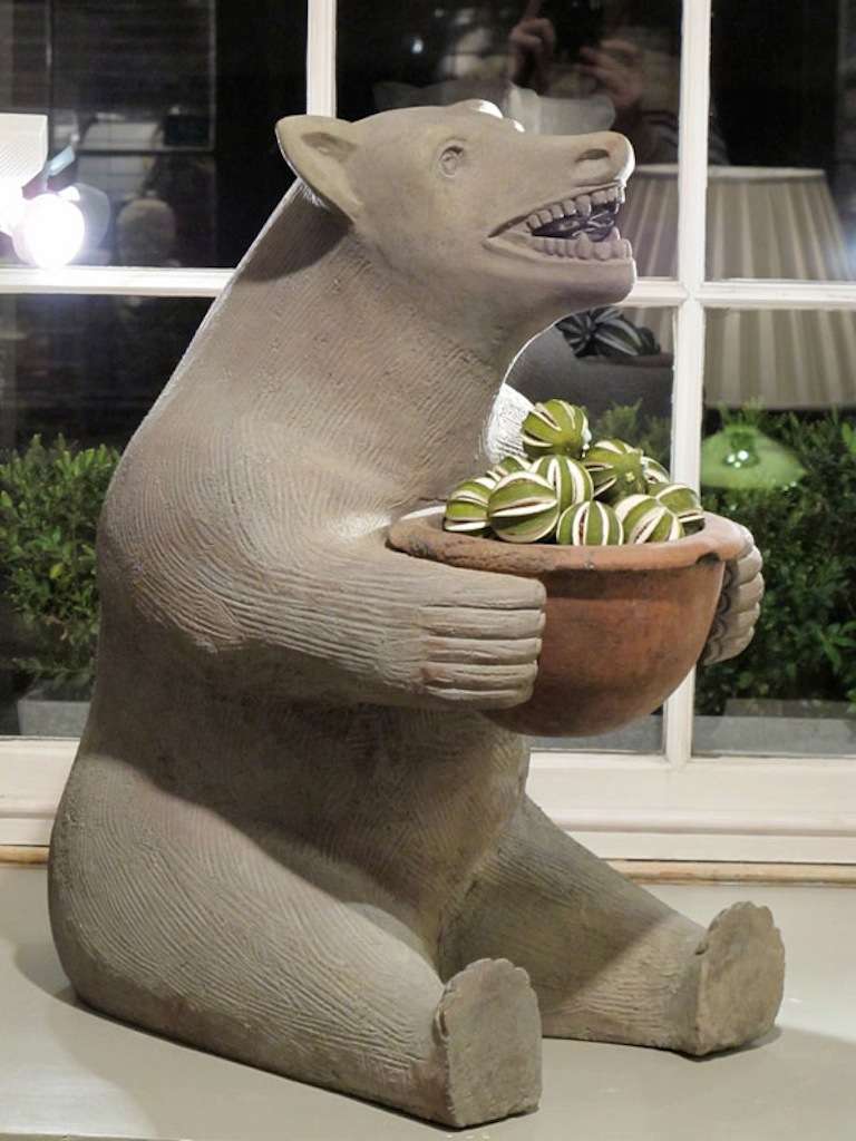 A very amusing pair of, circa 1920s, Terracotta bear statues of good size, each one, holding a detachable terracotta bowl / planter.

This pair of bears will look good either indoors or in a garden.