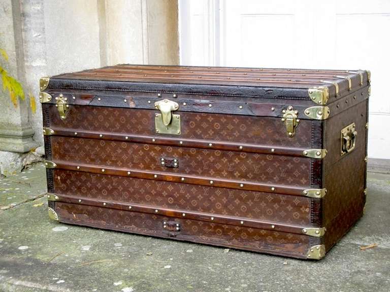 A wonderful, late 19th century French Louis Vuitton trunk,with its original woven fabric (with the logo) , brass studded and with the leather edge. 

Retaining the original trays. This stunning Louis Vuitton , will make an ideal coffee table, and