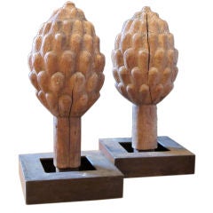 A pair of carved Oak artichoke finials