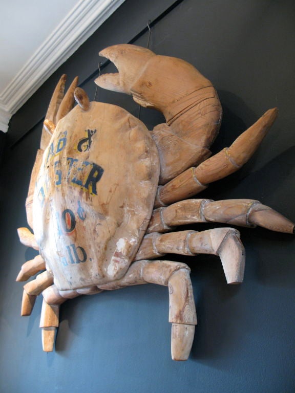 A very rare and unusual, carved American Pine wood, large scale advertising sign in the form of a Crab. The main body of the Crab is beautifully carved, with undulating curves along the shell. <br />
Circa 1900, and from New England, this wall