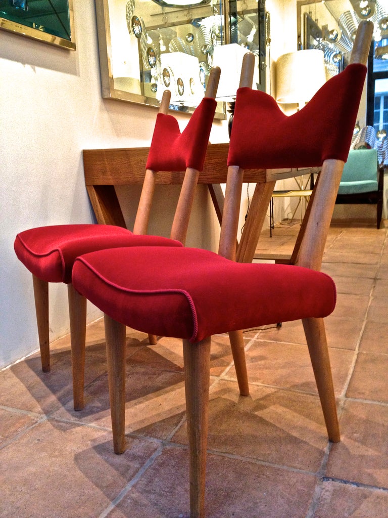 Jean Royère exceptional pair of documented chairs covered in red velvet documented in Jean Royère by Martin Vivier.