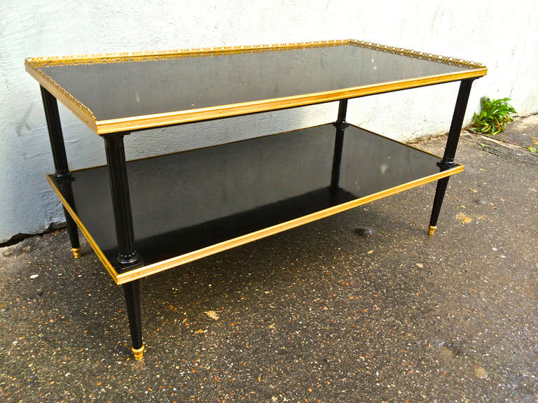 Maison Jansen super long two tiers coffee table in black lacquered wood and gold bronze gallery and hardware.