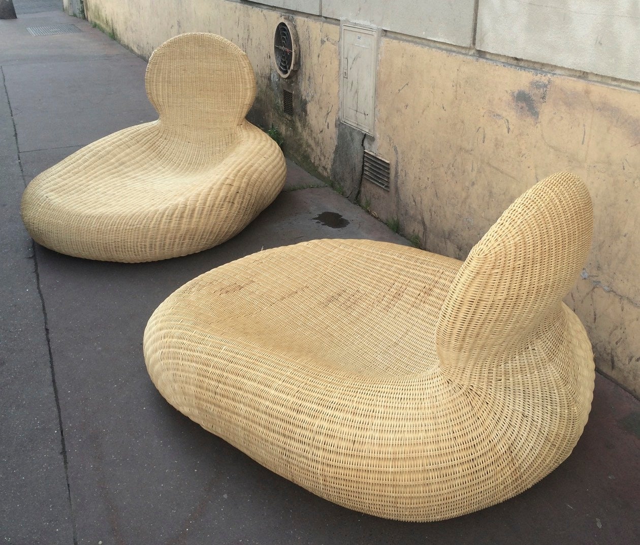 Awesome pair of anthropomorphic rattan lounge chairs.