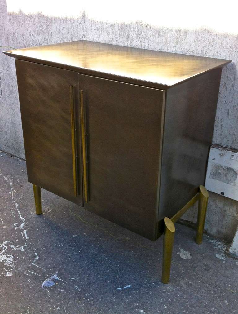 Awesome quality and design patinated bronze two-door cabinet.