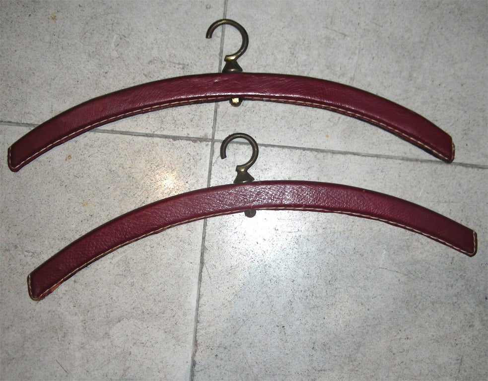 Brass Jacques Adnet Rare Pair of 'Hermes Red' Stitched Leather Shelves and Two Hangers For Sale