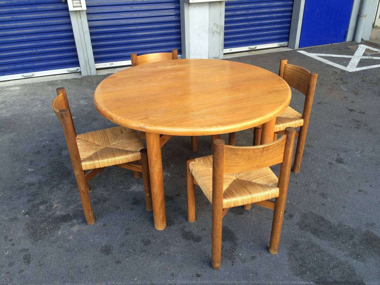 Charlotte Perriand pine round table and four meribel chairs in genuine condition.