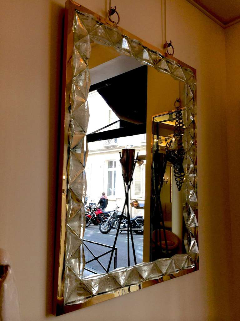André Hayat contemporary triangle pyramid rock crystal mirror with gold bronze frame and hanging rings.