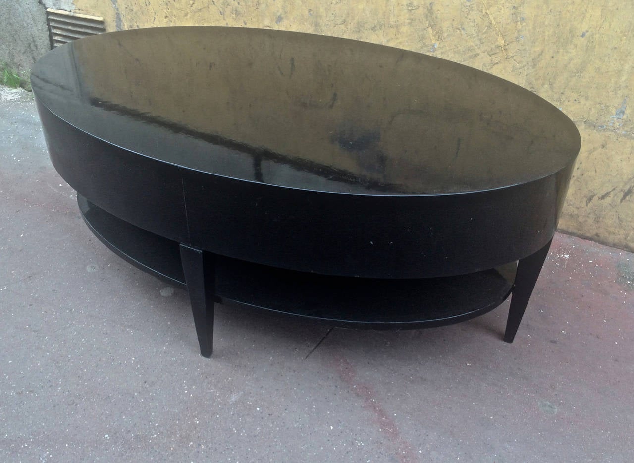 Superb very large black lacquered two-tier coffee table.
