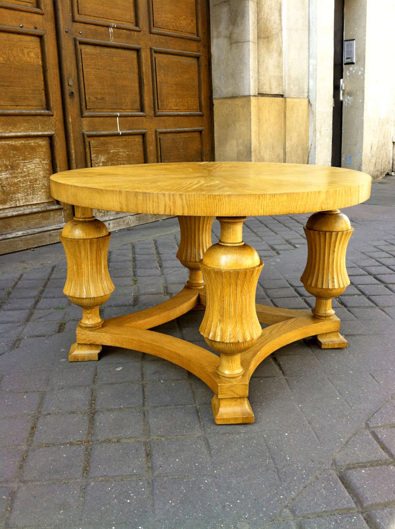 Neoclassic 1940s sturdy oak coffee with beautiful carving details.