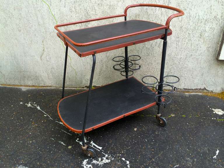 Jacques Adnet 1950s black and brown hand-stitched leather bar rolling table.