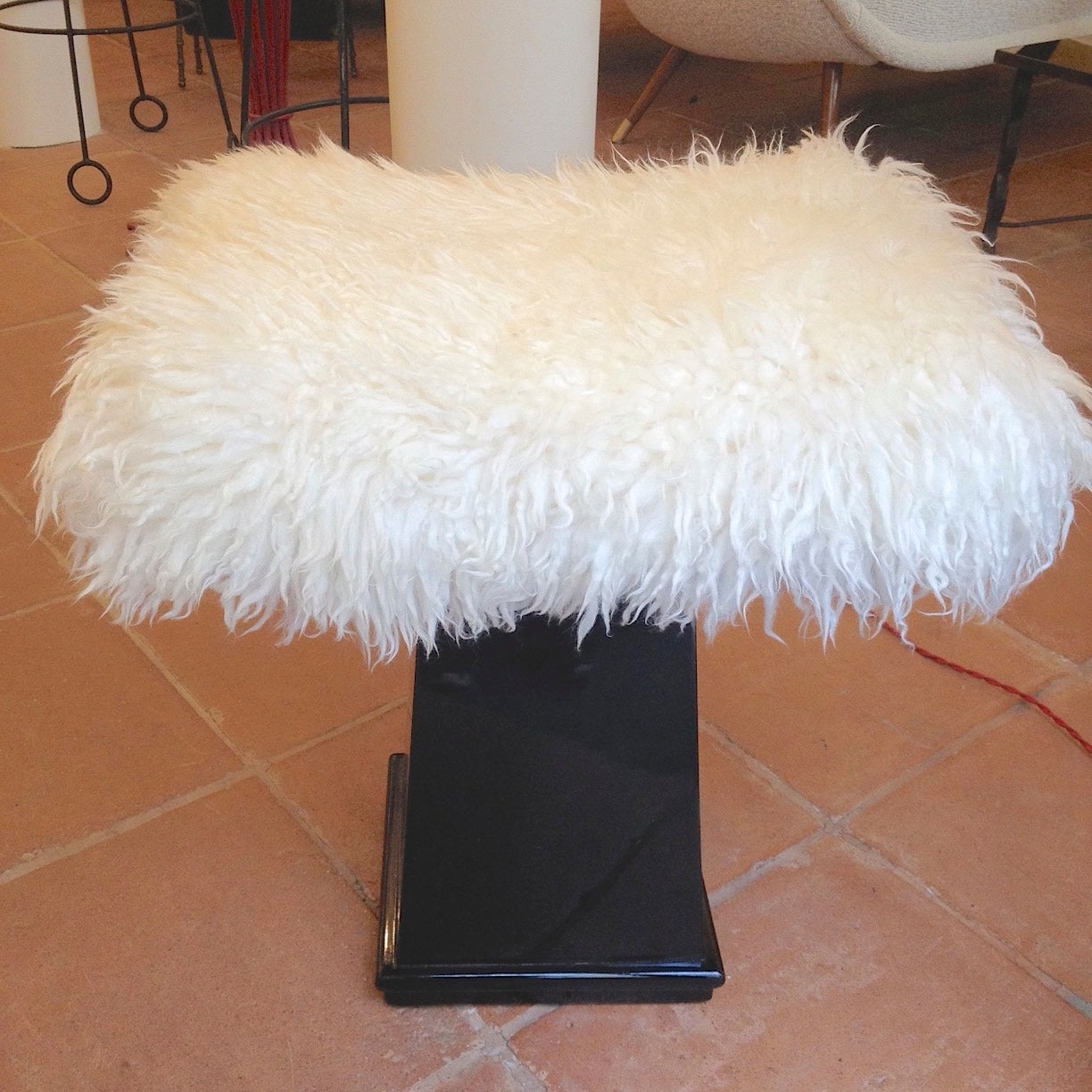 Spectacular Danish stool in black lacquered wood and real fur.