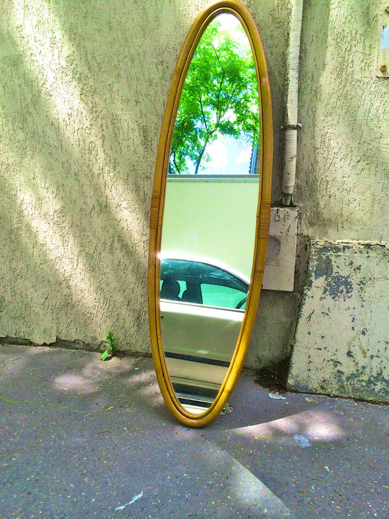 1950s Riviera superb design long oval rattan mirror in good vintage condition.