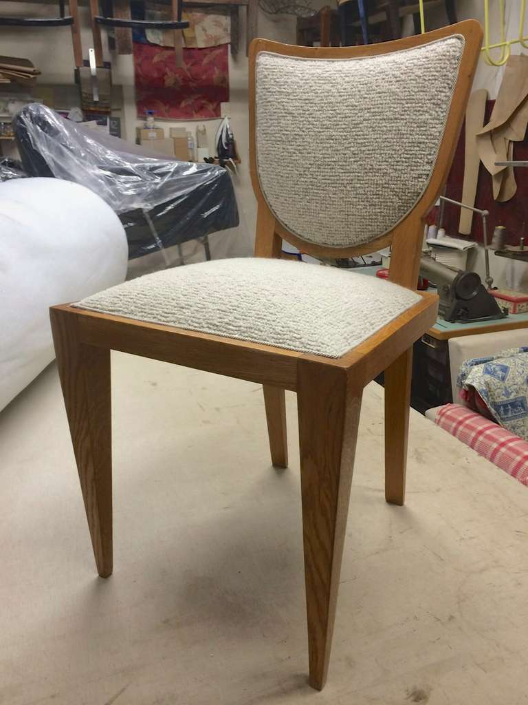 JEAN ROYERE pair of  ecusson chair newly upholstered in almond green mohair velvet
with frame in blond oak