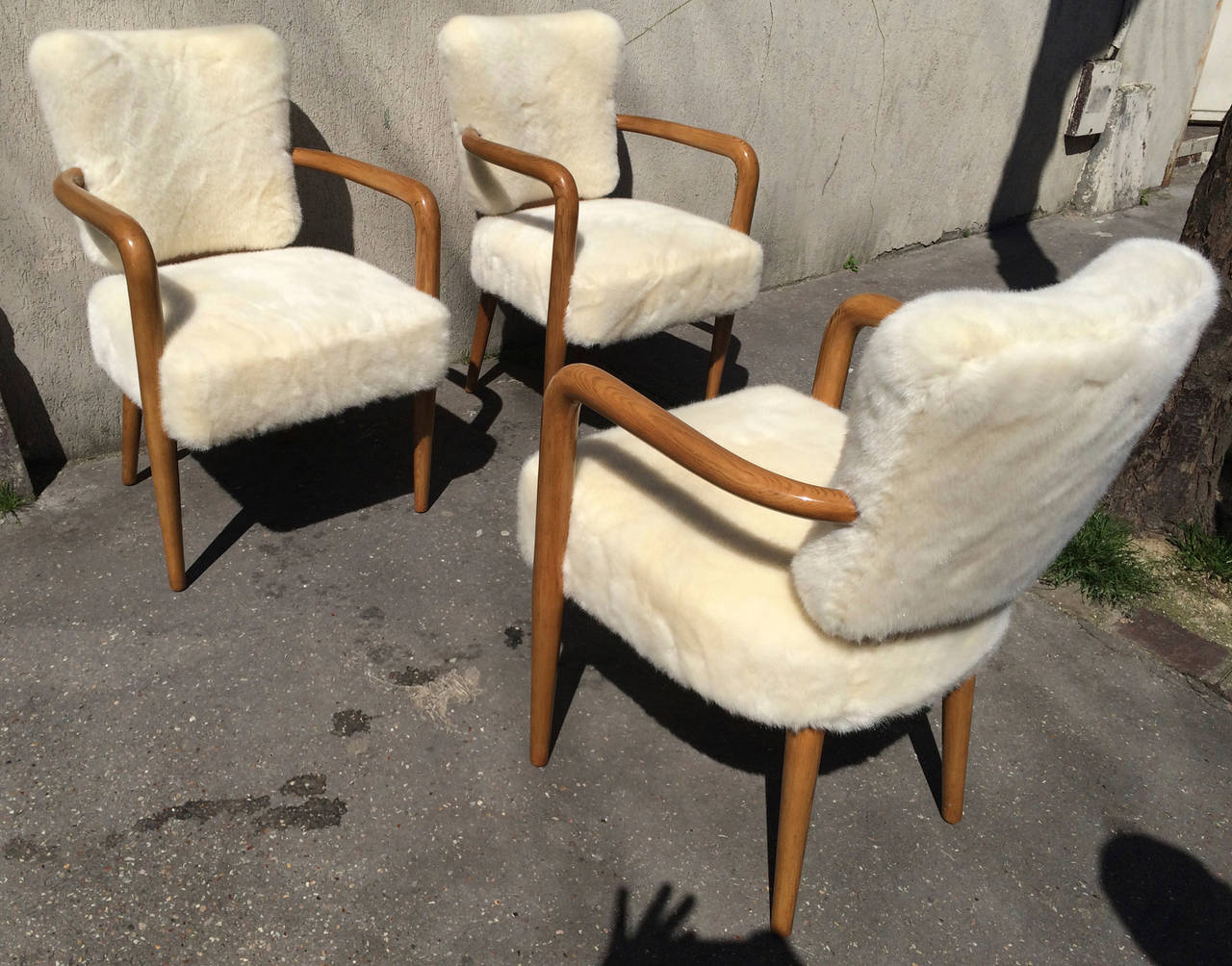 Renou et Genisset documented rare set of three desk chairs newly covered in faux fur cloth.