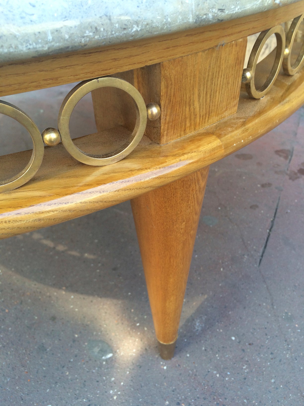 Jean Royère ash tree tri-legged coffee table with marble top and gold bronze.