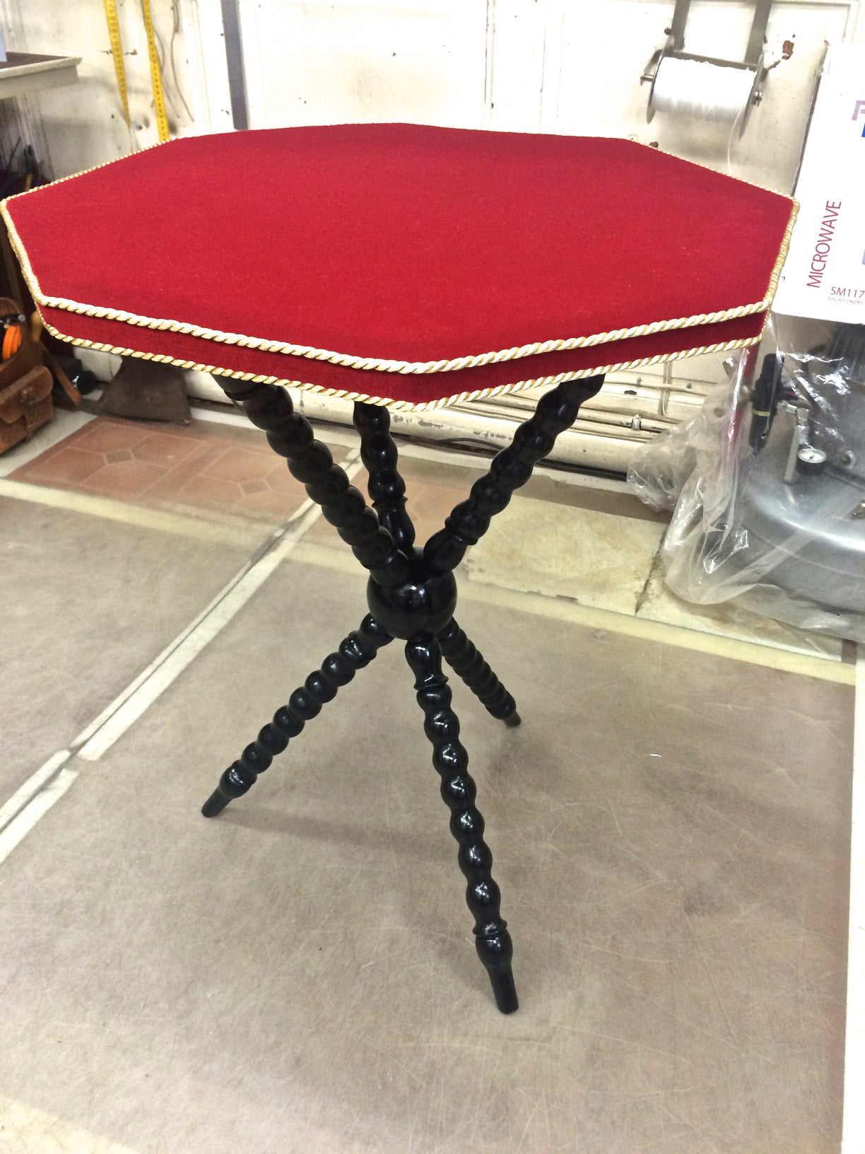 1940s spectacular pair of neoclassic side tables with red velvet top and gold trimming.