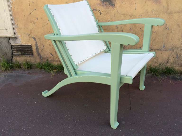 Rare Art Deco pair of garden lounge chairs in pale green lacquer color.