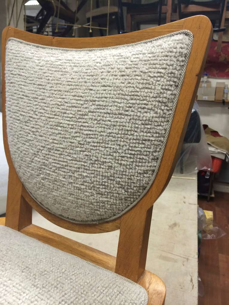 Oak Jean Royère Documented Pair of Chairs, Newly Upholstered in Maharam Bouclé For Sale