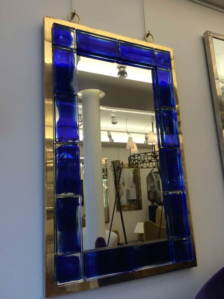 Andre Hayat contemporary deep blue brick gold bronze frame mirror.