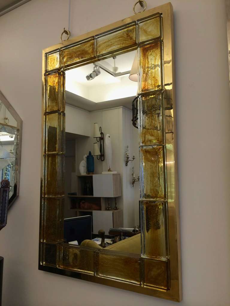 Andre Hayat contemporary honey gold brick with a gold bronze frame mirror.