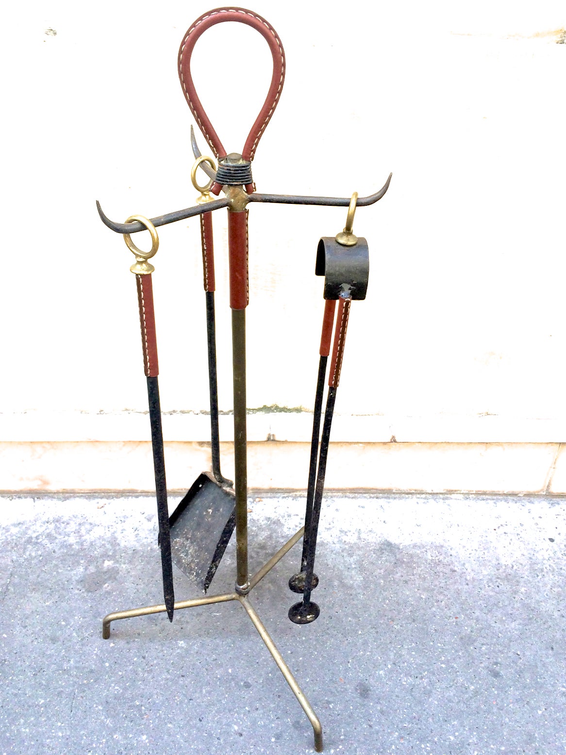 Jacques Adnet vintage fire tools in hand-stitched leather and wrought iron.