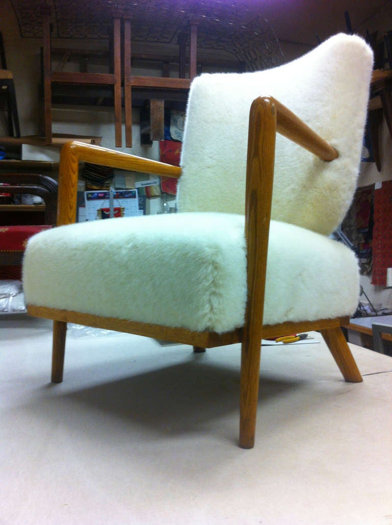 Mid-20th Century Jean Royere Genuise Model Ecusson Pair Of Oak And Faux Fur Lounge Chairs