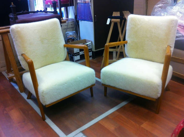 JEAN ROYERE genuine model ecusson pair of oak and faux fur lounge chairs (original chairs  vintage  condition before
restoration available)