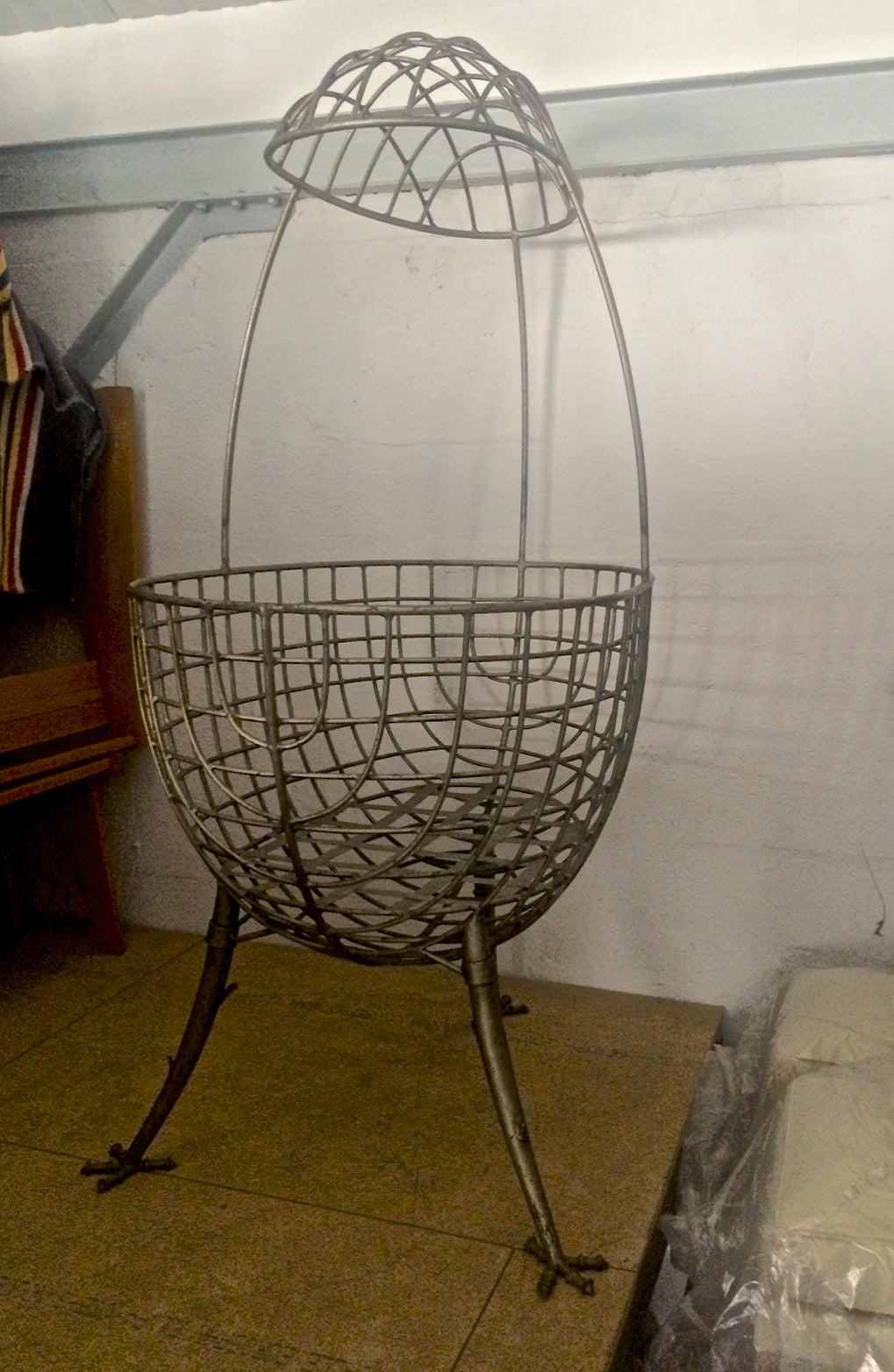 French Egg-Shape Cradle in Sculptured Wrought Iron with Chicken Legs For Sale