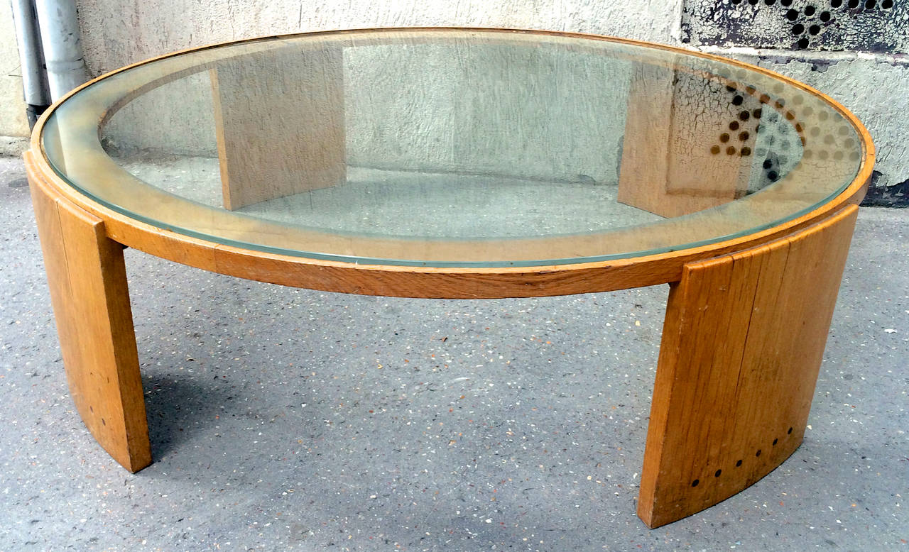 Jacques Adnet rare very large round coffee table in oak and glass top.