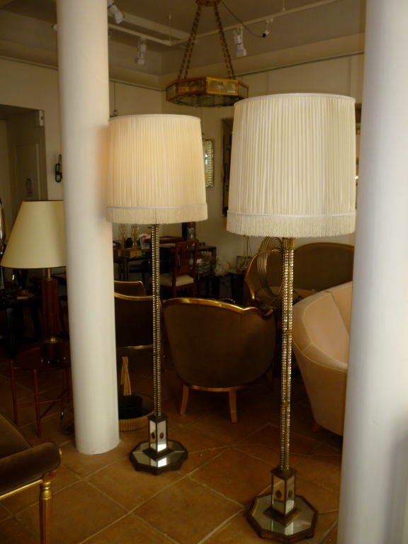 Very rare early pair of vintage standing lamps by Maison Bagues in gold lead wrought iron, mirror and pearls.