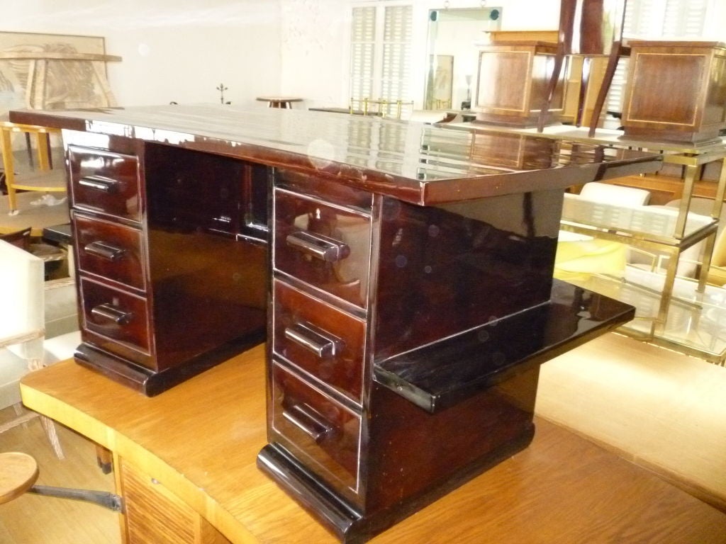 Beautiful design French Art Deco desk with six drawers on one side and shelves on the other with very elegant curved design.