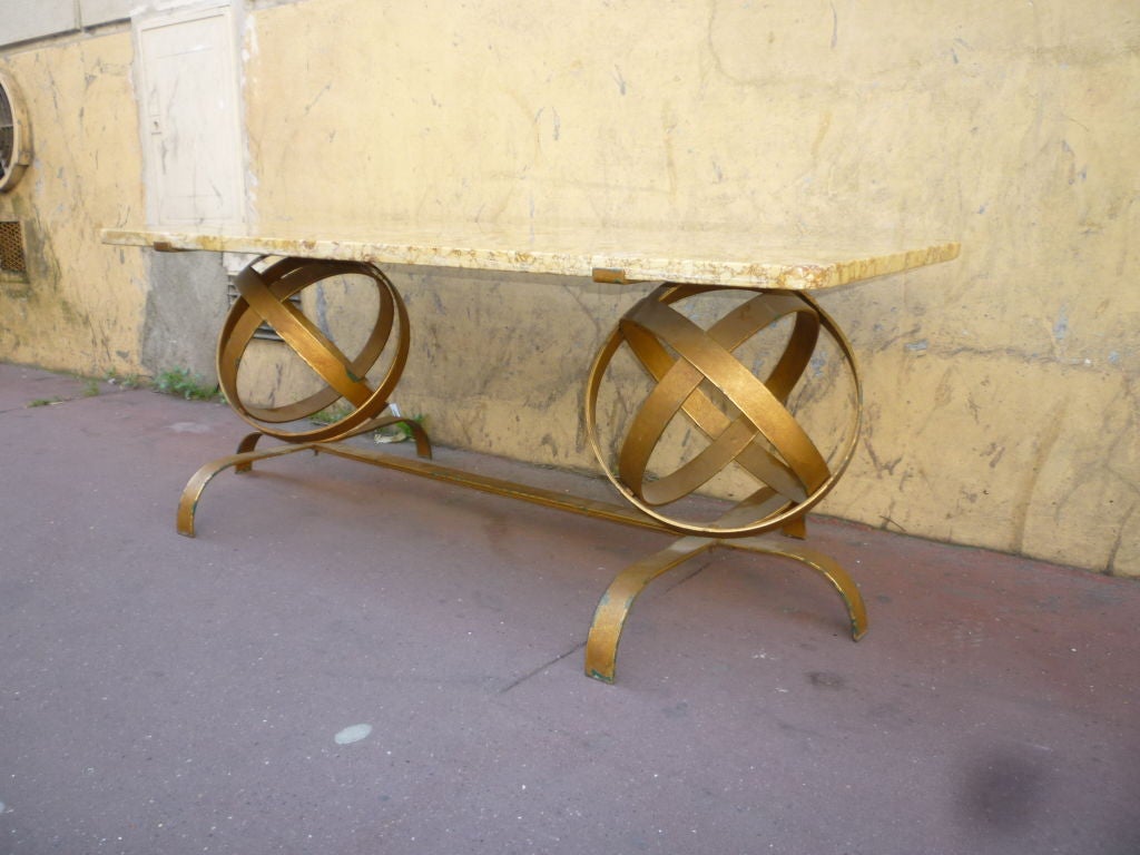 Gold wrought iron french 1950's coffee table with an original stone top including fossiles and globes designed legs all in excellent vintage condition