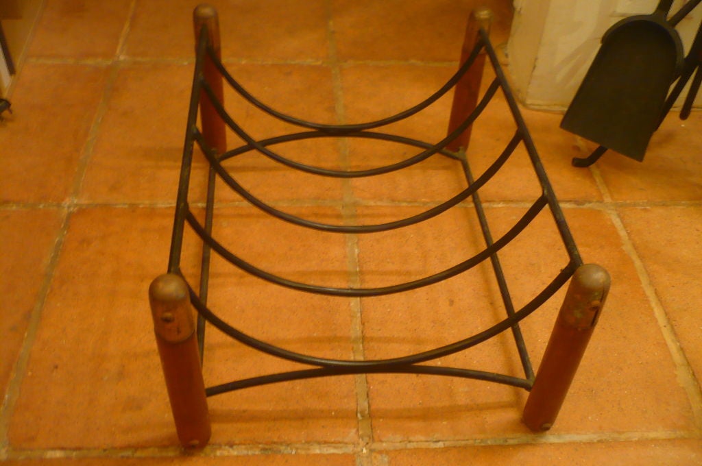 Vintage 1950s solid wood, iron and brass log holder.