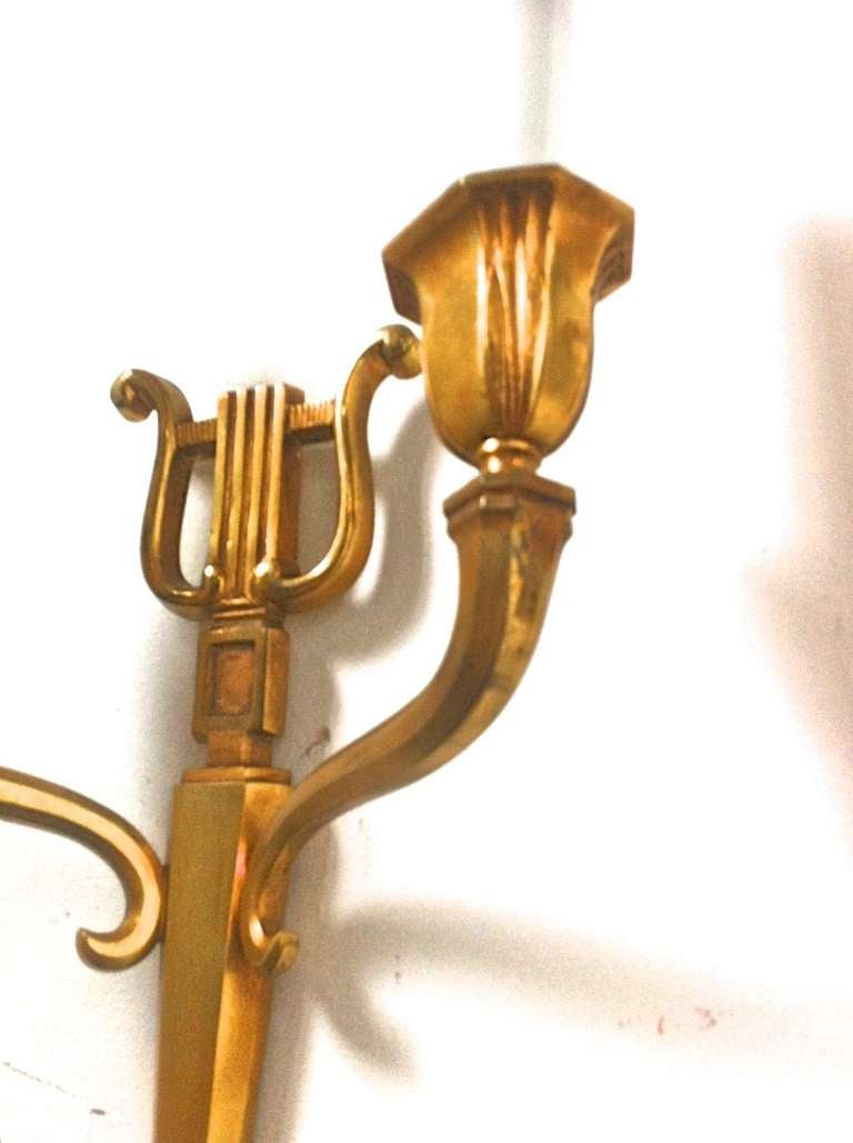Maison Baguès refined gold bronze harp pair of sconces.